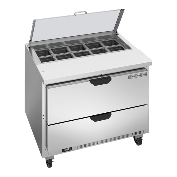 A stainless steel Beverage-Air refrigerated sandwich prep table with two drawers and a clear lid.