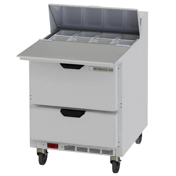 A Beverage-Air refrigerated sandwich prep table with 2 drawers and a lid open.