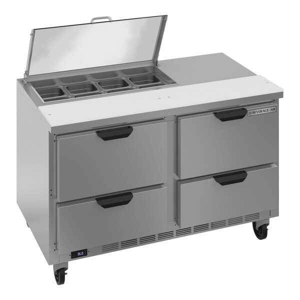 A Beverage-Air stainless steel commercial sandwich prep table with clear lids on four drawers.