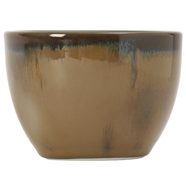 A brown and white ceramic bouillon cup with a blue and black rim.