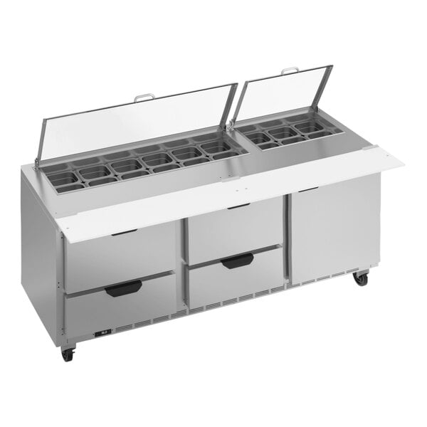 A large stainless steel Beverage-Air sandwich prep table with clear lids over drawers.