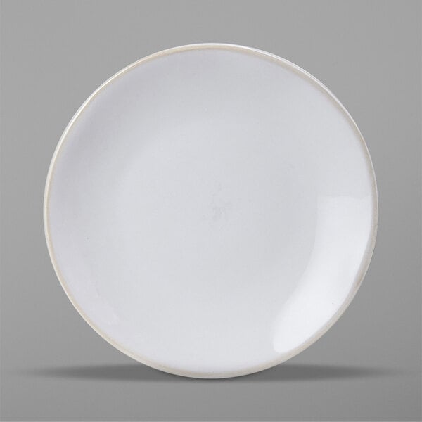 A Tuxton Artisan Agave white china plate with a rim.