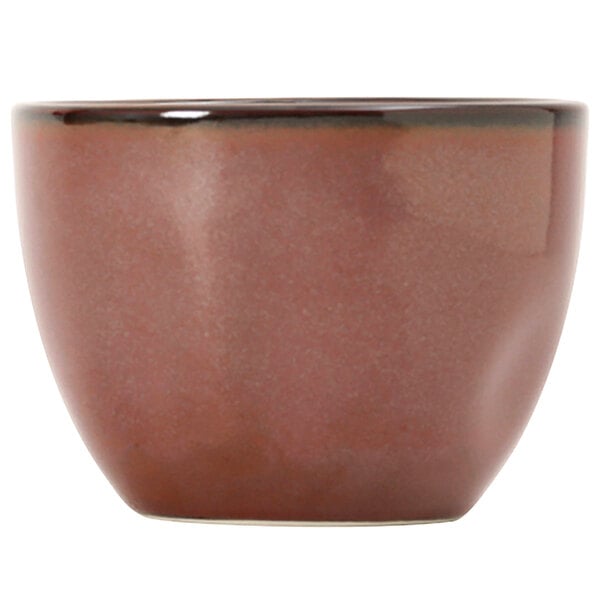 A brown ceramic Tuxton bouillon cup with a black rim.