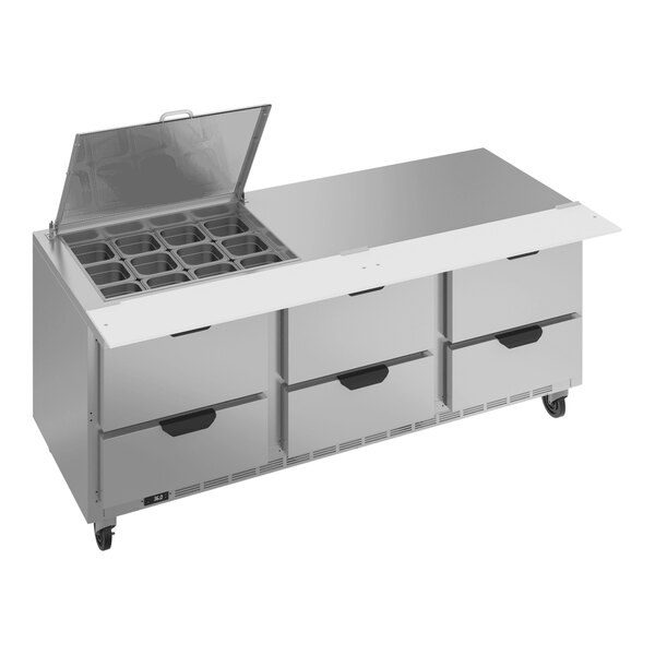 A Beverage-Air stainless steel refrigerated prep table with drawers and clear lids.