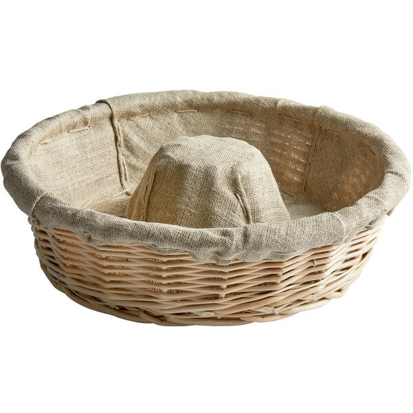 A linen-lined wicker banneton with a crown-shaped design.