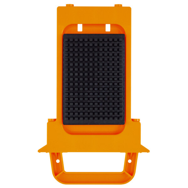 An orange rectangular object with black and orange square parts.