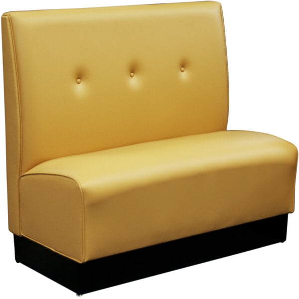 A yellow leather American Tables & Seating booth with buttons.