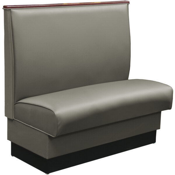 A grey booth with black leather upholstery and wood top cap.