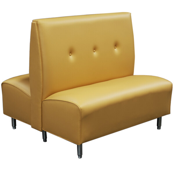 A yellow leather booth with metal legs.