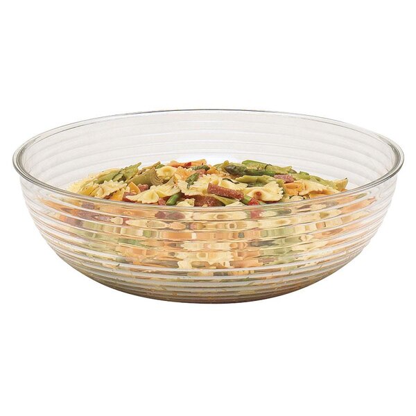 A Cambro clear ribbed serving bowl filled with pasta and vegetables.