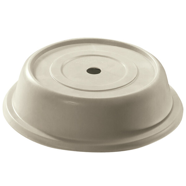 A white plastic bowl with a hole in the center covered by a Cambro antique parchment plate cover.