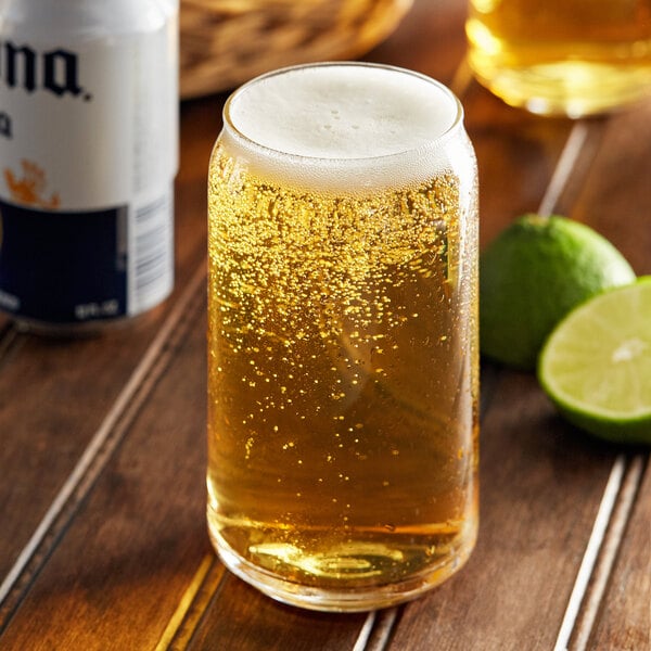 A glass of beer with a lime slice on the rim.