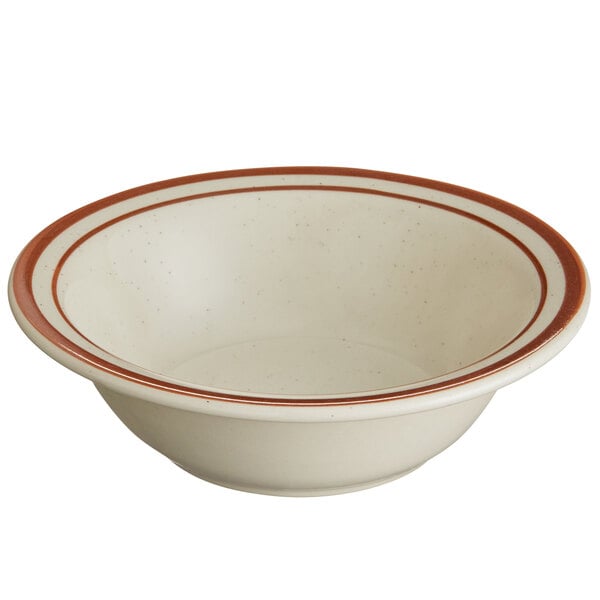 A white narrow rim stoneware bowl with brown stripes.