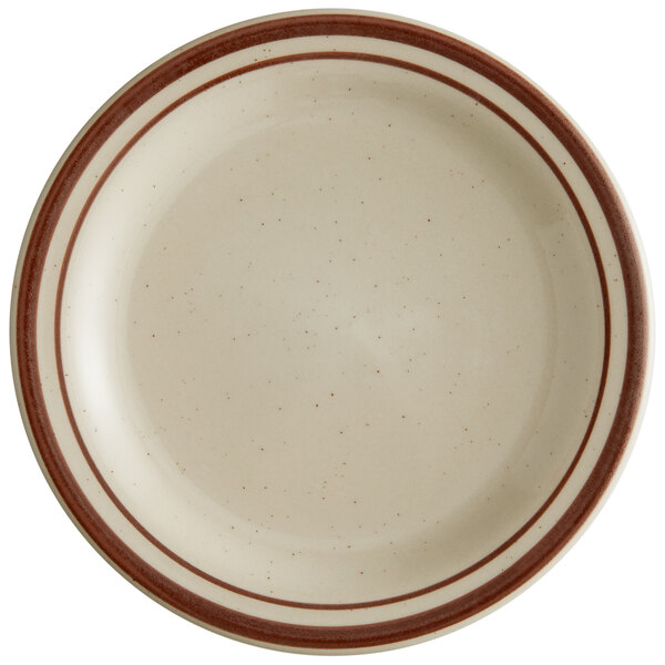 A Libbey narrow rim stoneware plate with brown stripes on it.