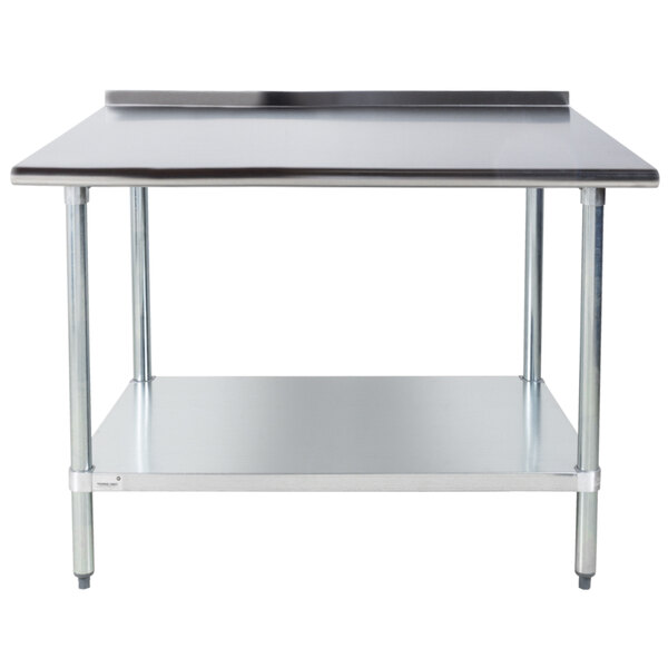 An Advance Tabco stainless steel work table with a shelf.