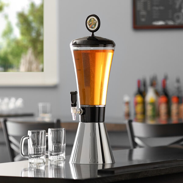 A Beer Tubes metal conic beer tower on a table with beer glasses.