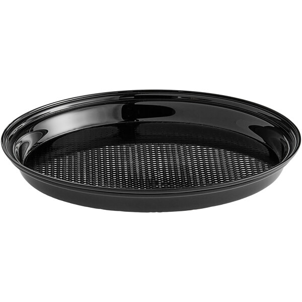 A black round tray with a perforated surface.
