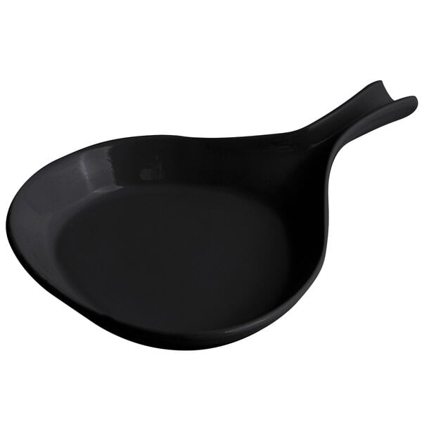 A black pan with a handle.
