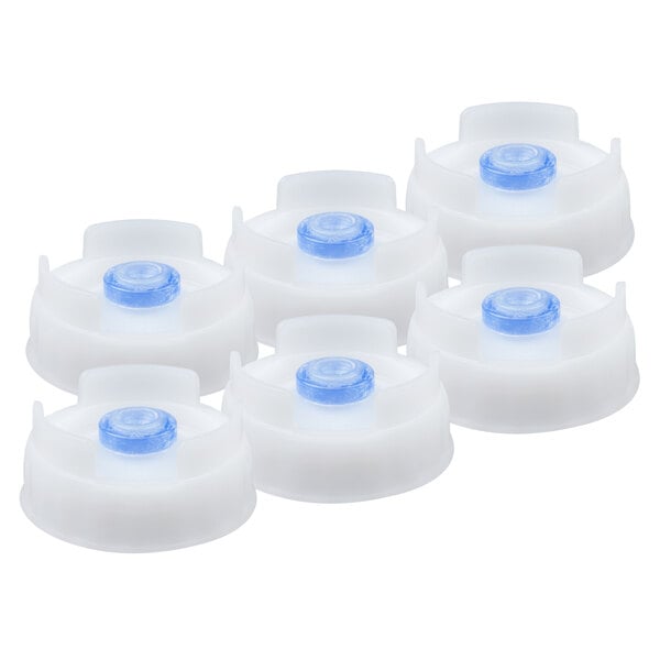 A group of white plastic containers with blue and white lids.