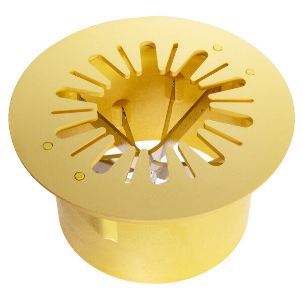 A yellow plastic circular object with holes in it.