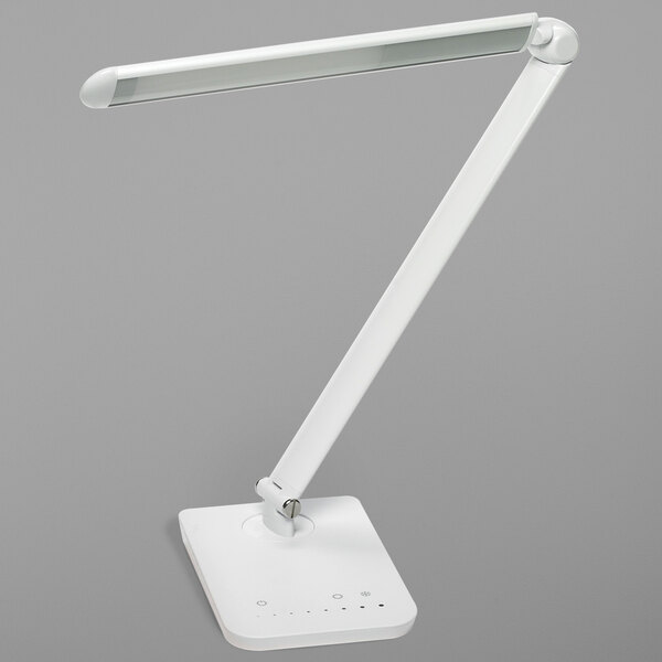 A white Safco Vamp LED desk lamp with a long, adjustable arm and USB port.