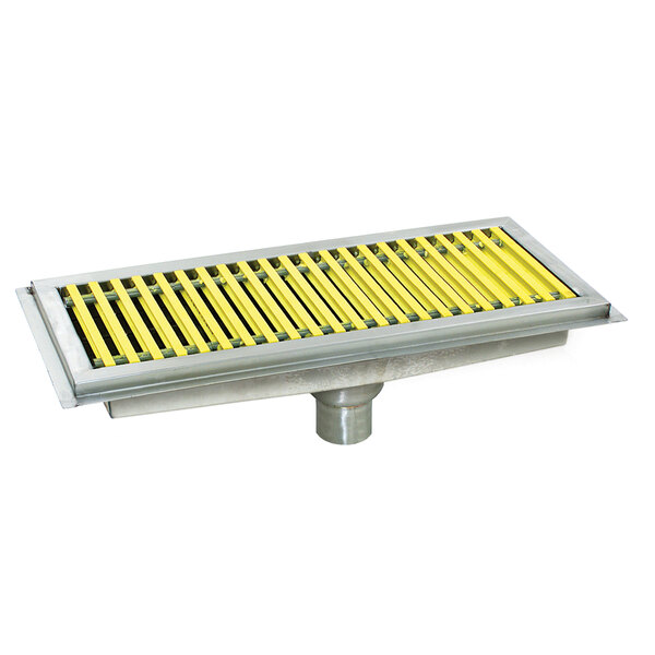 A metal floor trough with yellow and white fiberglass grating.