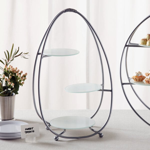An American Metalcraft silver metal stand with three tiers of frosted glass plates.