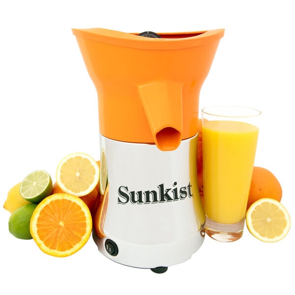 A Sunkist orange juicer next to oranges.