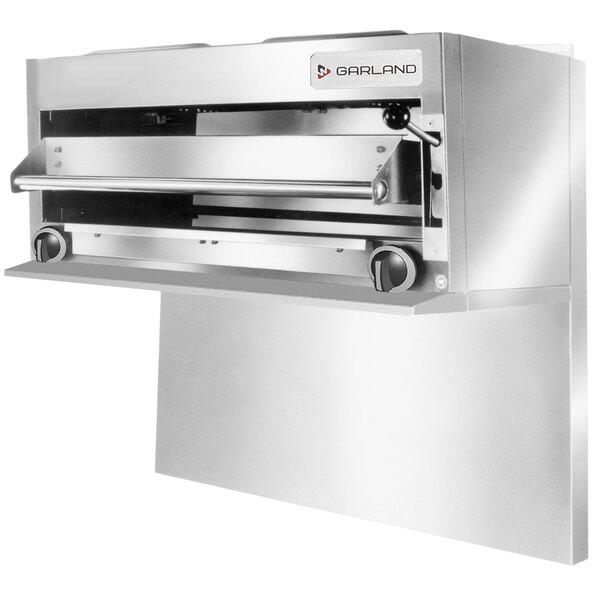A silver stainless steel Garland salamander broiler with a door open.