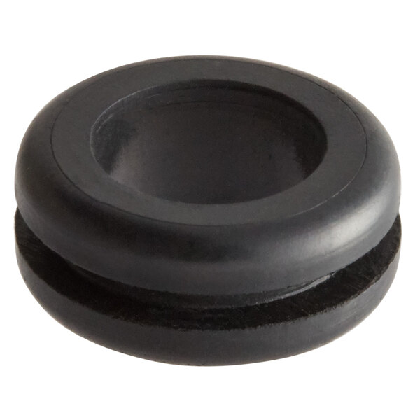 A black round Sunkist electric cord bushing with a hole in it.
