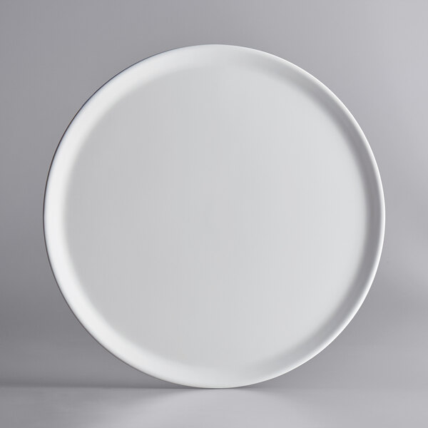 A GET Madison Avenue round white melamine display tray with a round rim.