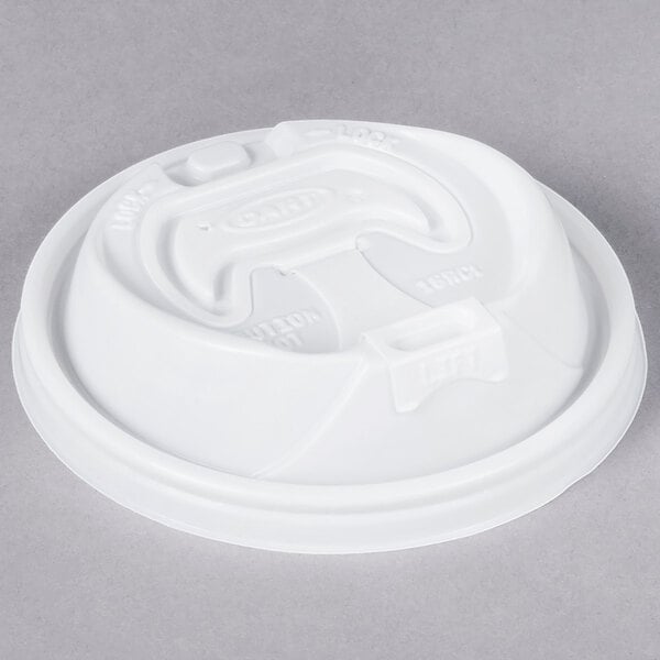 A white Dart plastic lid with a reclosable tab.