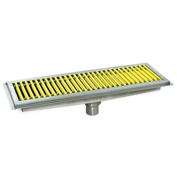 A metal floor trough drain with yellow and black stripes and yellow fiberglass grating.