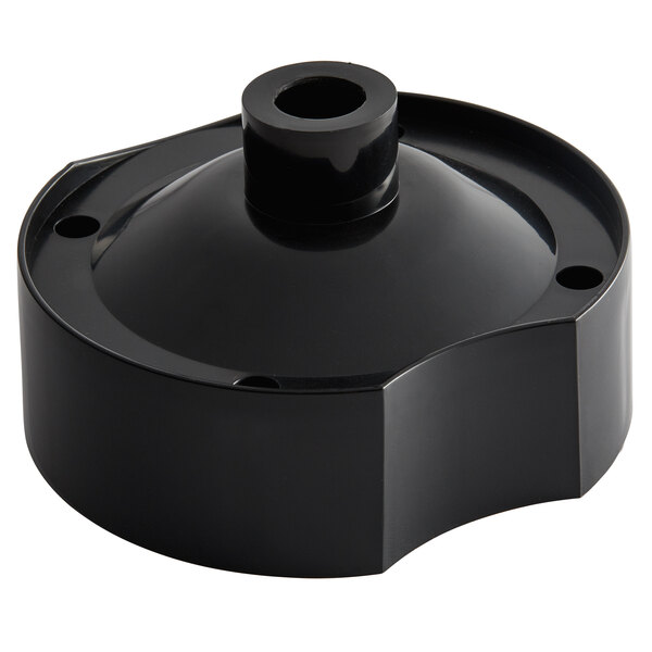 A black plastic dome cover with a hole in the center.