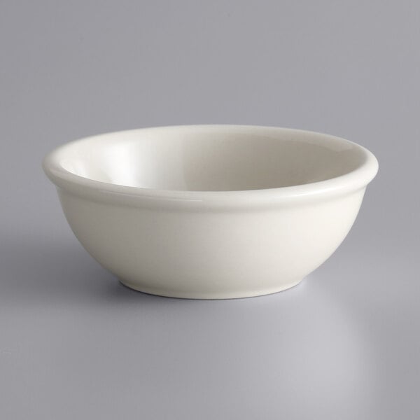 A Libbey Princess White stoneware oatmeal bowl with rolled edge on a white surface.