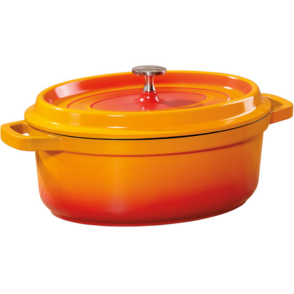 An orange enamel oval dutch oven with a lid.