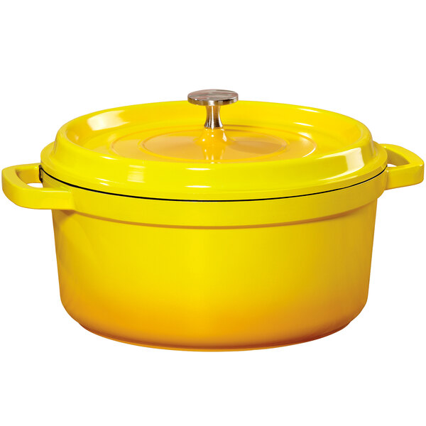 A GET yellow enamel coated cast aluminum dutch oven with a lid.