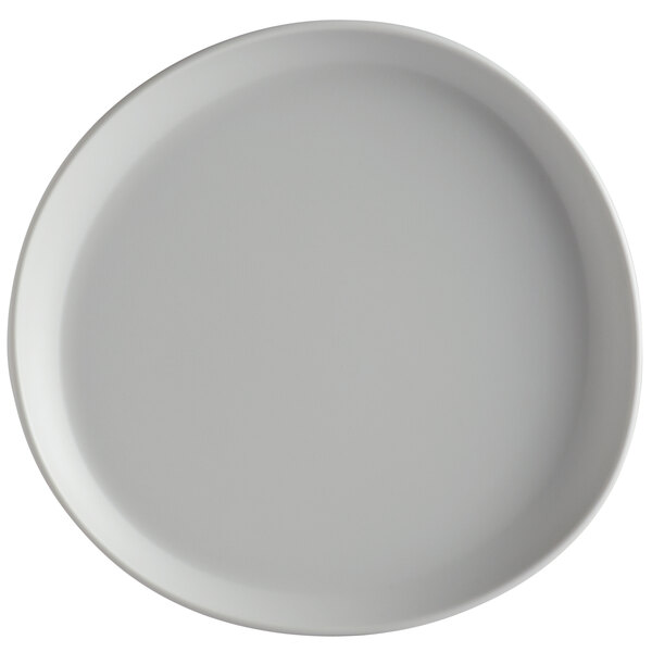 A light gray melamine coupe plate with an irregular round shape and matte finish.
