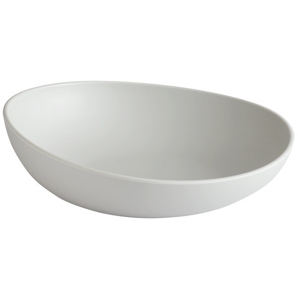 A light gray irregular round melamine serving bowl.