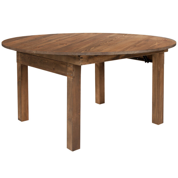 A Flash Furniture Hercules 60" round wooden farm table with legs.