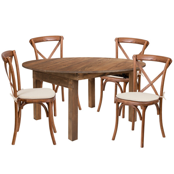 A Flash Furniture rustic wooden farm table with four chairs and white cushions.