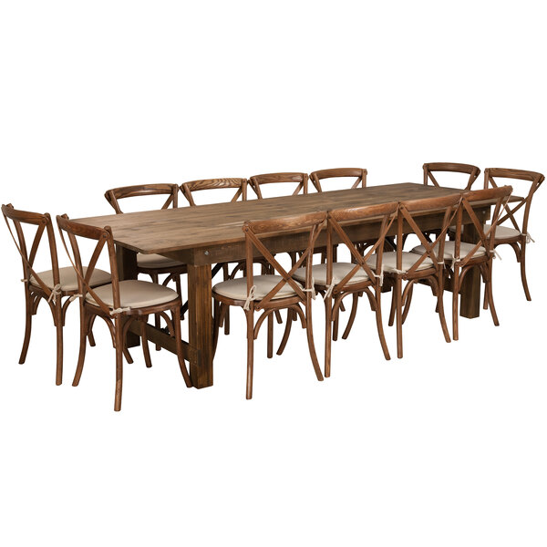 A Flash Furniture rustic farm table with chairs and cushions.
