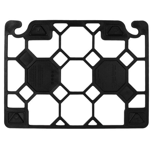 A black square cutting board with hexagonal holes in the corners.