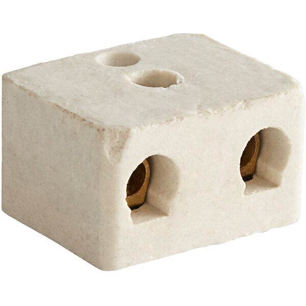A white block with two holes in it.
