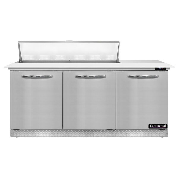 A stainless steel Continental Refrigerator sandwich prep table with three doors open.