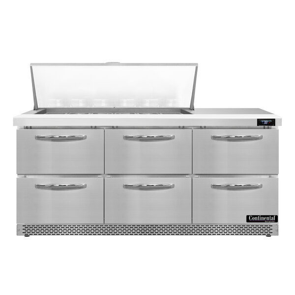 A stainless steel Continental Refrigerator with 6 drawers on a counter in a professional kitchen.