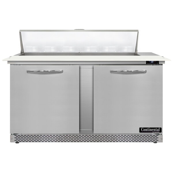 A stainless steel Continental Refrigerator with two doors and a cutting top.