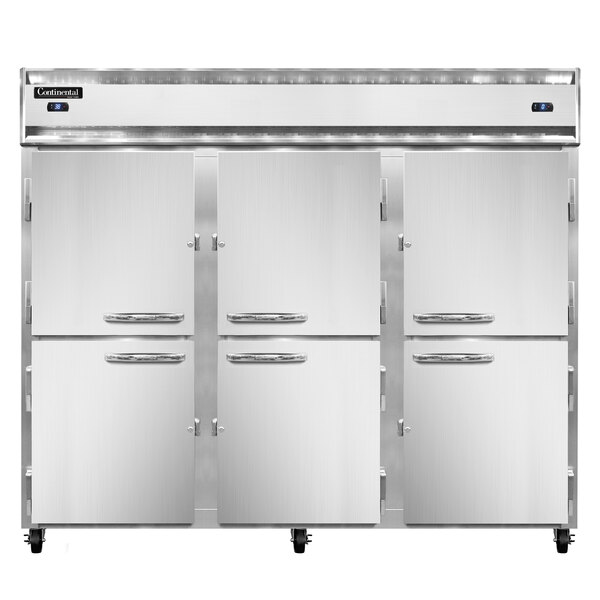 A white Continental Refrigerator with three half doors open with silver handles.