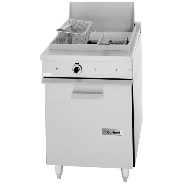 A Garland stainless steel gas floor fryer with a basket.