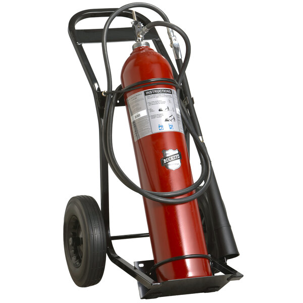A red Buckeye fire extinguisher on a hand truck.